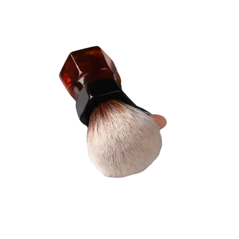 A yaqi 24mm synthetic hair shaving brush with dense white bristles and an amber acrylic handle with black ferrule
