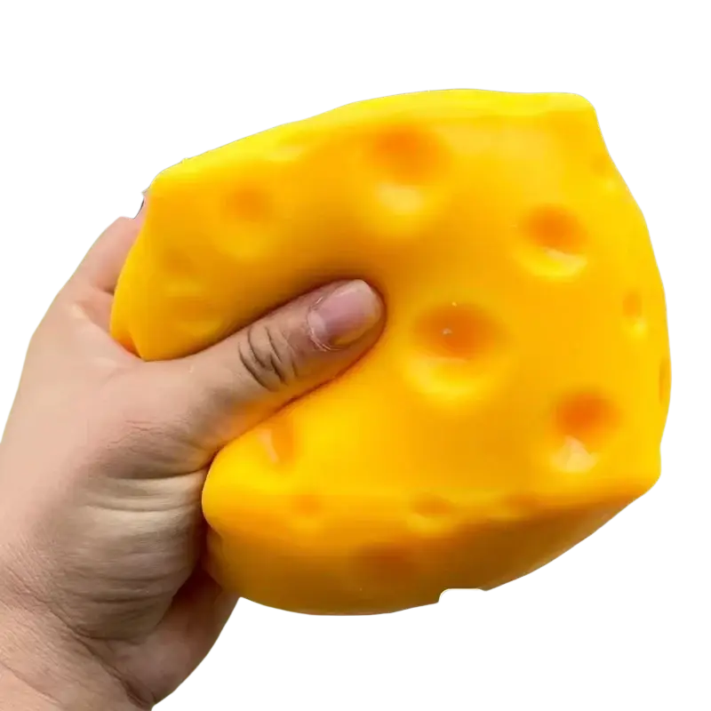Bright yellow cheese-shaped squishy stress relief toy with soft texture and characteristic holes for anxiety relief