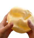 Yellow cheese squishy stress relief toy featuring a soft pale yellow vaseline-themed smooth and slightly glossy surface