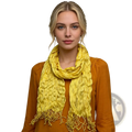 A vibrant yellow crinkle scarf textured summer silk accessory with fringed edges worn around the neck