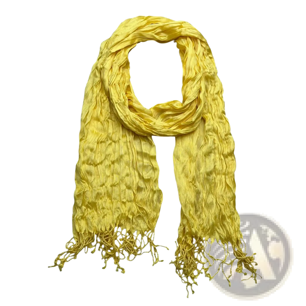 A vibrant yellow crinkle scarf made of textured summer silk with fringed ends perfect as a stylish accessory