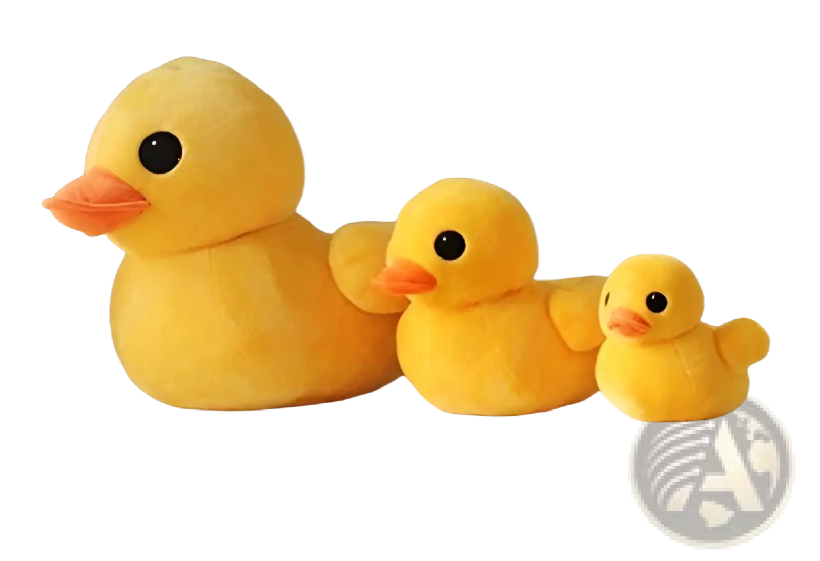 Three plush yellow rubber duck soft stuffed animals in varying sizes arranged on a white bench
