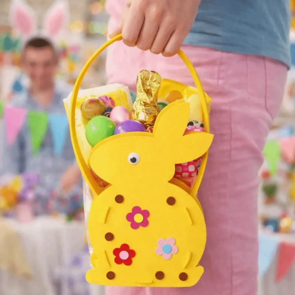 Yellow felt easter bunny basket gift bag with colorful flower decals and brown dot accents in bunny shape