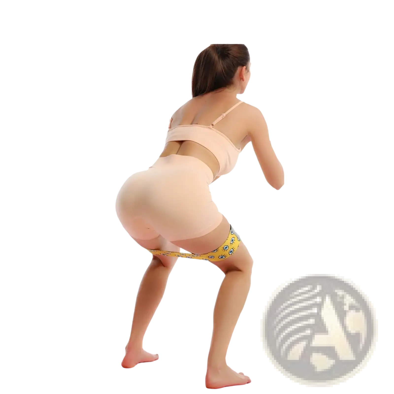 Yellow glute resistance band for women legs worn around thighs featuring a blue and white patterned design