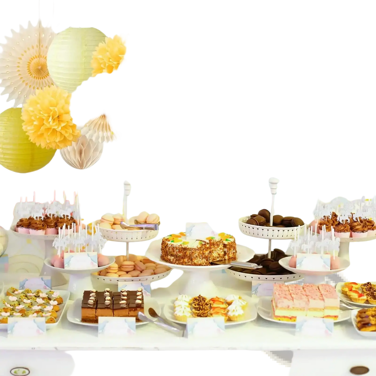 A cheerful yellow and white paper pom-pom garland made of paper hangs above a dessert table for party decoration
