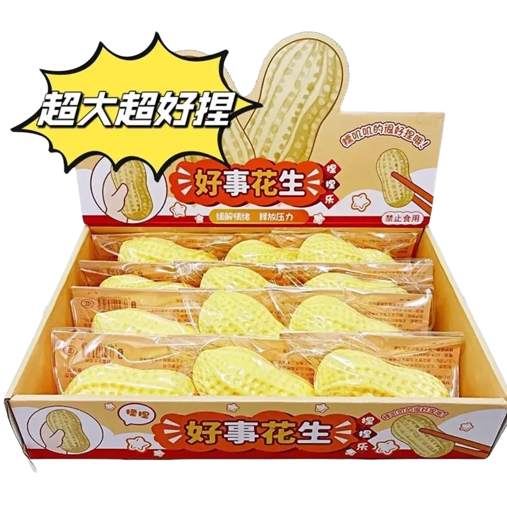 Yellow peanut-shaped stress relief squishy toys made of soft material packaged in clear bags in a cardboard display box