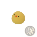 A soft yellow rubber chicken stress ball with black dot eyes and an orange beak for squeezing relief