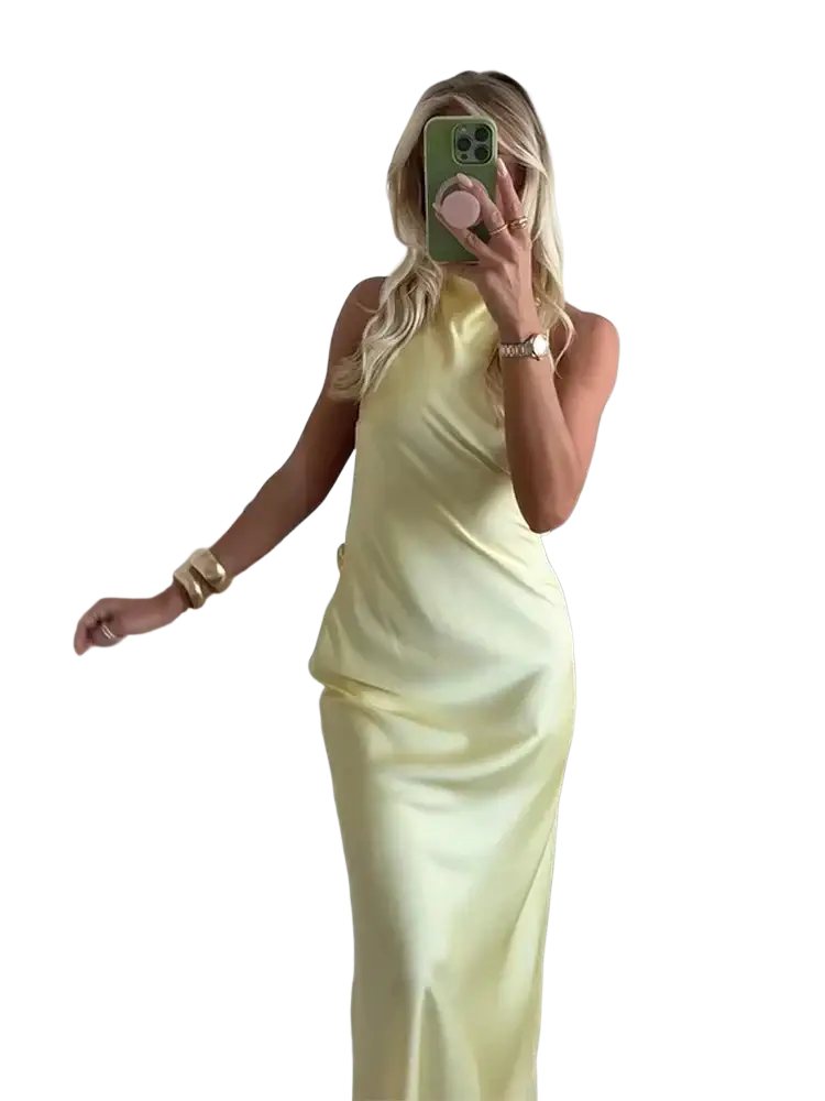 A sleek pale yellow satin halter evening maxi dress with high neckline and flowing silhouette