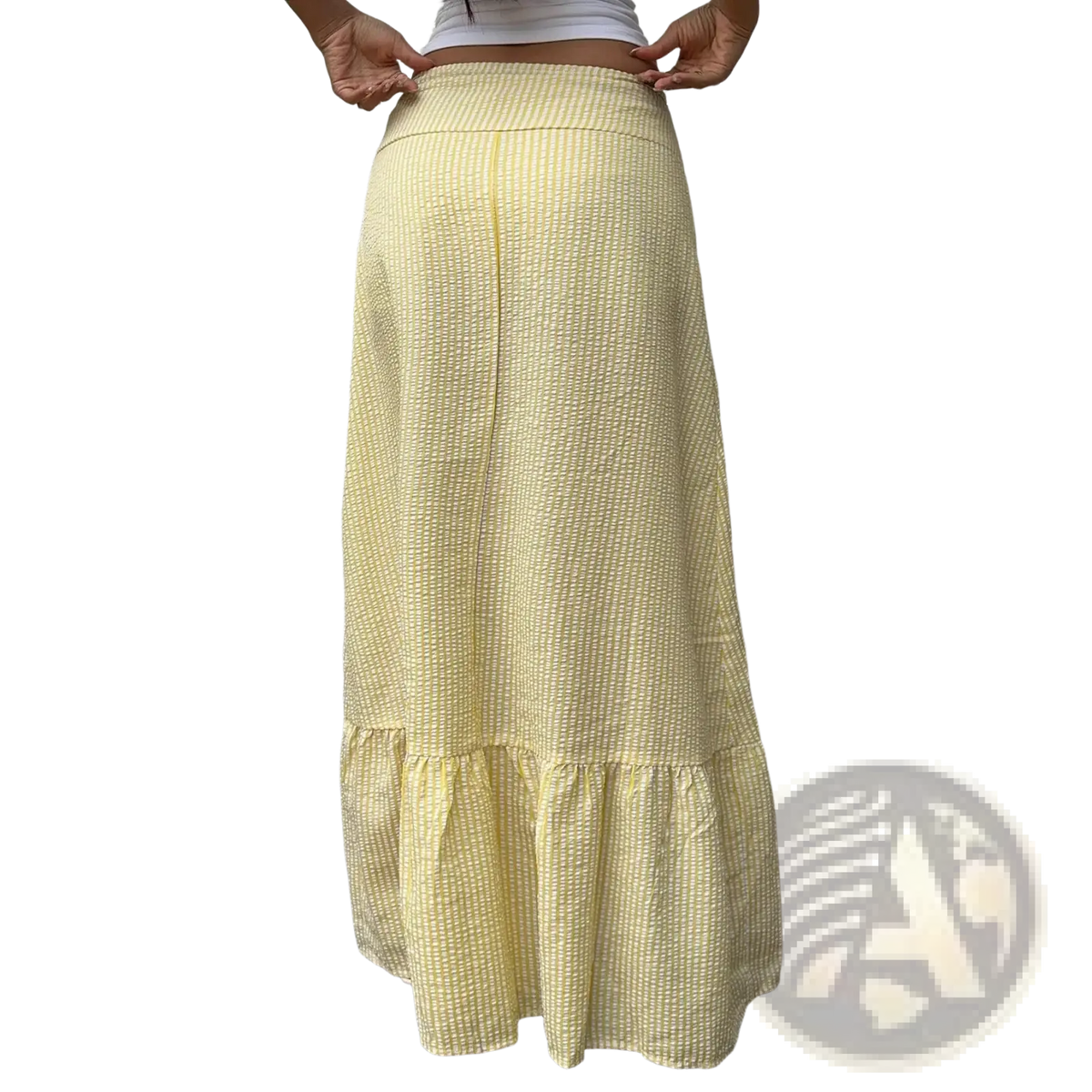 Yellow striped maxi skirt in waffle knit fabric with pale yellow color and ruffled hemline texture