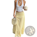 A flowing yellow striped maxi skirt with ribbed texture and ruffled hem in pale yellow fabric
