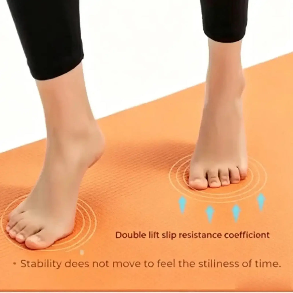 Orange non slip thick yoga mat with textured surface and circular grip markings for portable exercise and fitness use