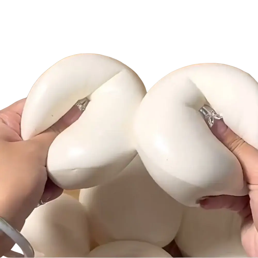 White soft silicone yogurt cake stress relief squishy toy with a smooth rounded shape and subtle center indentation