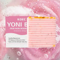 Pink striped feminine yoni bar soap with speckled texture and yellow accents for natural odor control to reduce odor