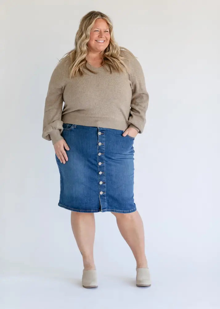 Blue denim midi skirt with white front buttons and kick pleat in the zana collection