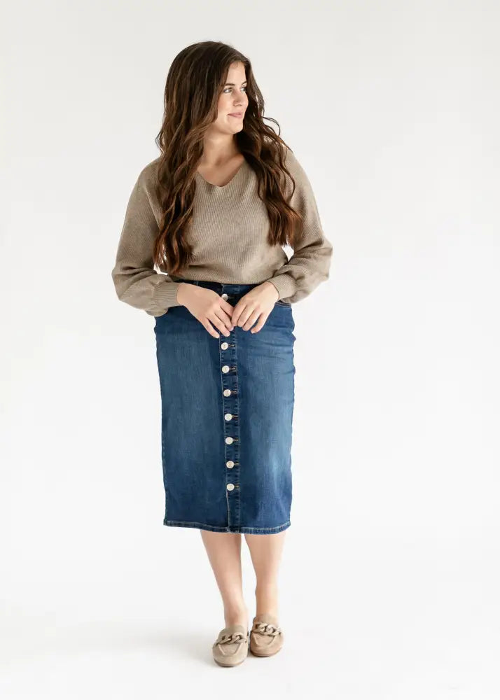 Zana front button denim midi skirt in blue with mid-length cut, front button closure, and subtle whiskering details