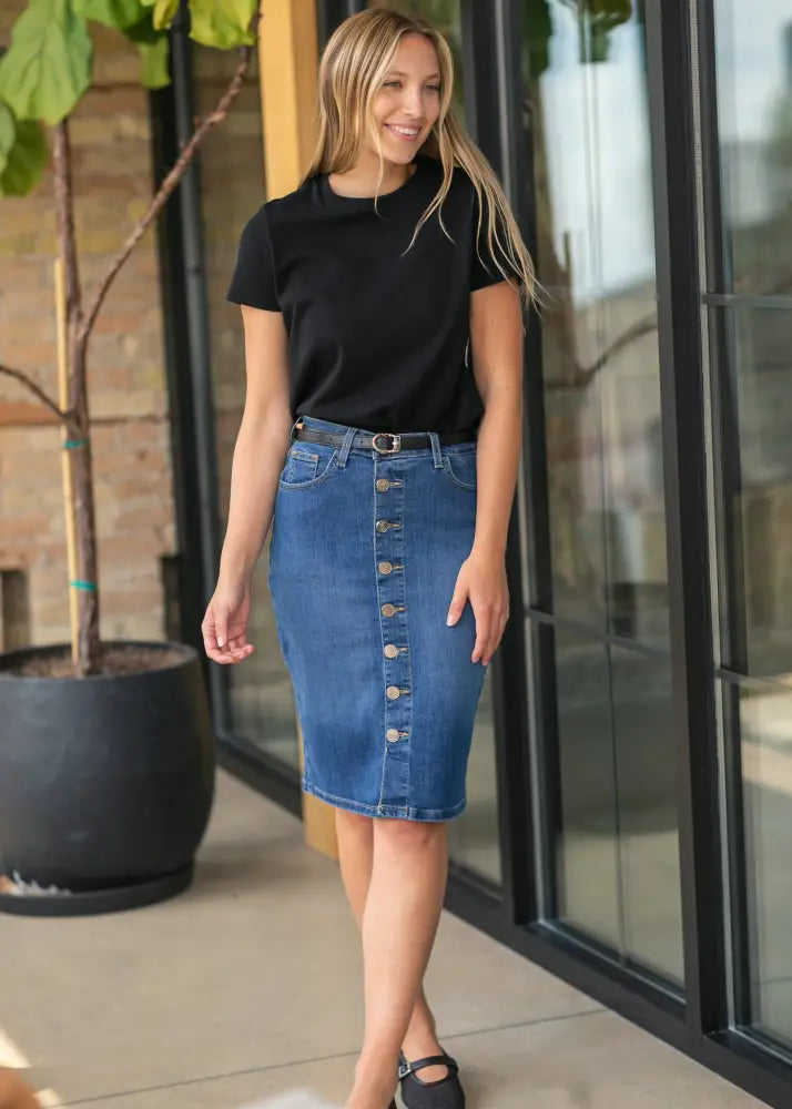 Blue denim midi skirt with front button closure and kick pleat in a casual stylish design