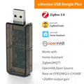 Black translucent plastic zigbee usb dongle plus with visible circuit board and silver metallic connector for home assistant