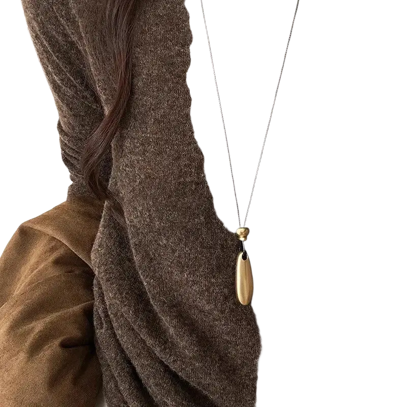 Minimalist zinc alloy rope chain necklace with slender wooden teardrop pendant and gold toned bead on black cord