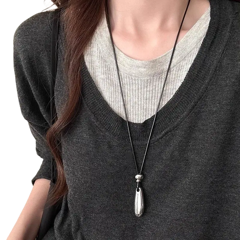 Silver zinc alloy teardrop pendant necklace with polished finish on black rope chain type for elegant wear