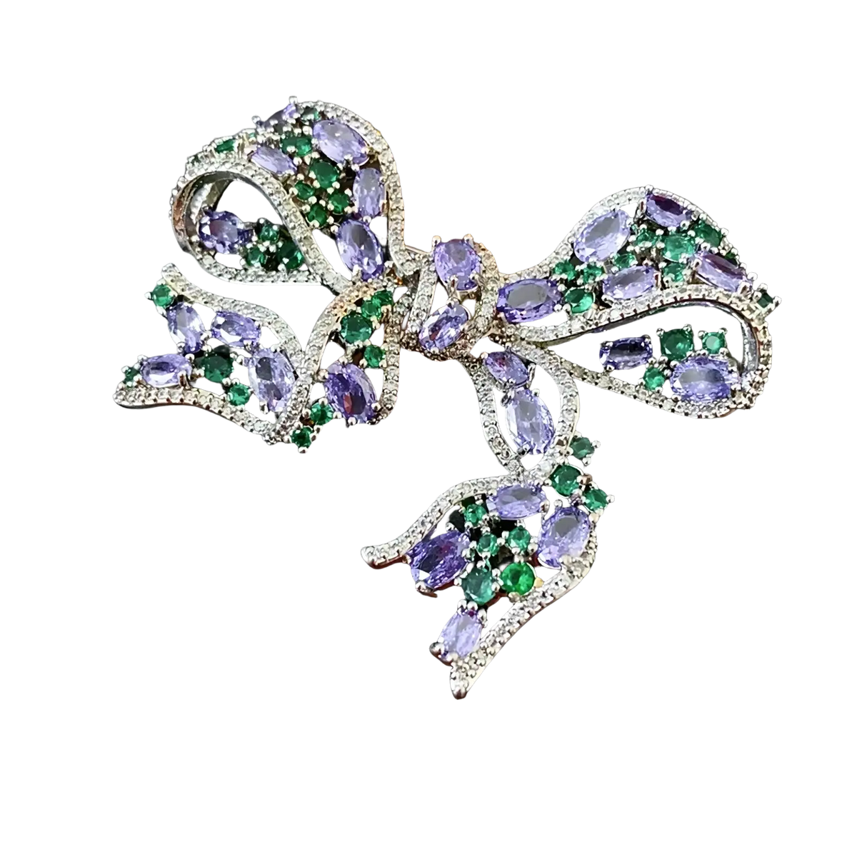 A sparkling silver zircon bow brooch with oval-cut purple and green gemstones luxury French design jewelry