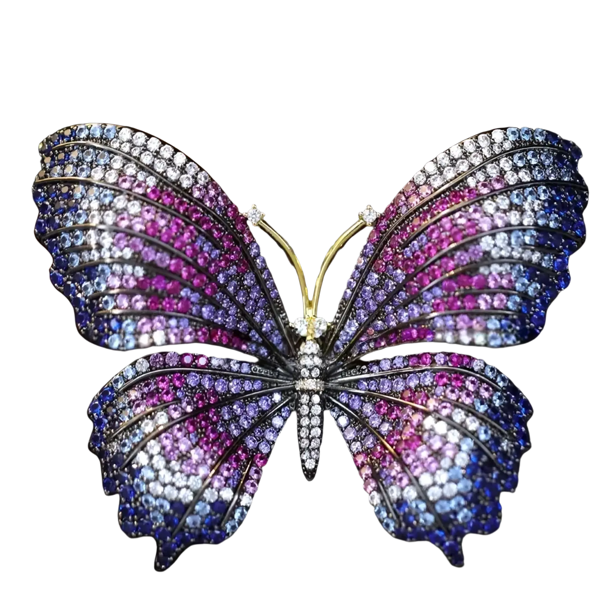 Zircon butterfly brooch with vibrant purple pink and blue gemstones set in a gold-toned metal frame