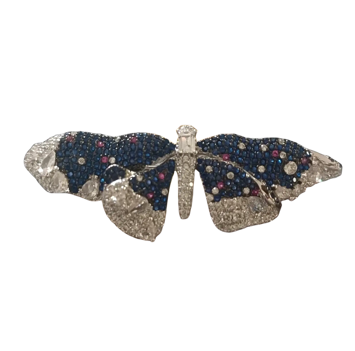 A sparkling butterfly-shaped zircon brooch with blue sapphires pink rubies and diamonds in a platinum frame