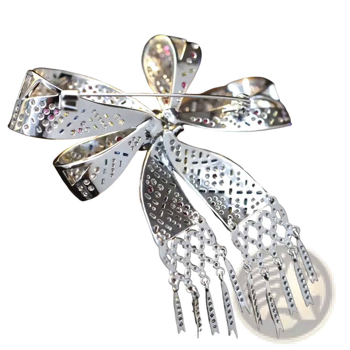 A sparkling silver zircon butterfly brooch with intricate cut-out patterns and pink blue clear gemstones