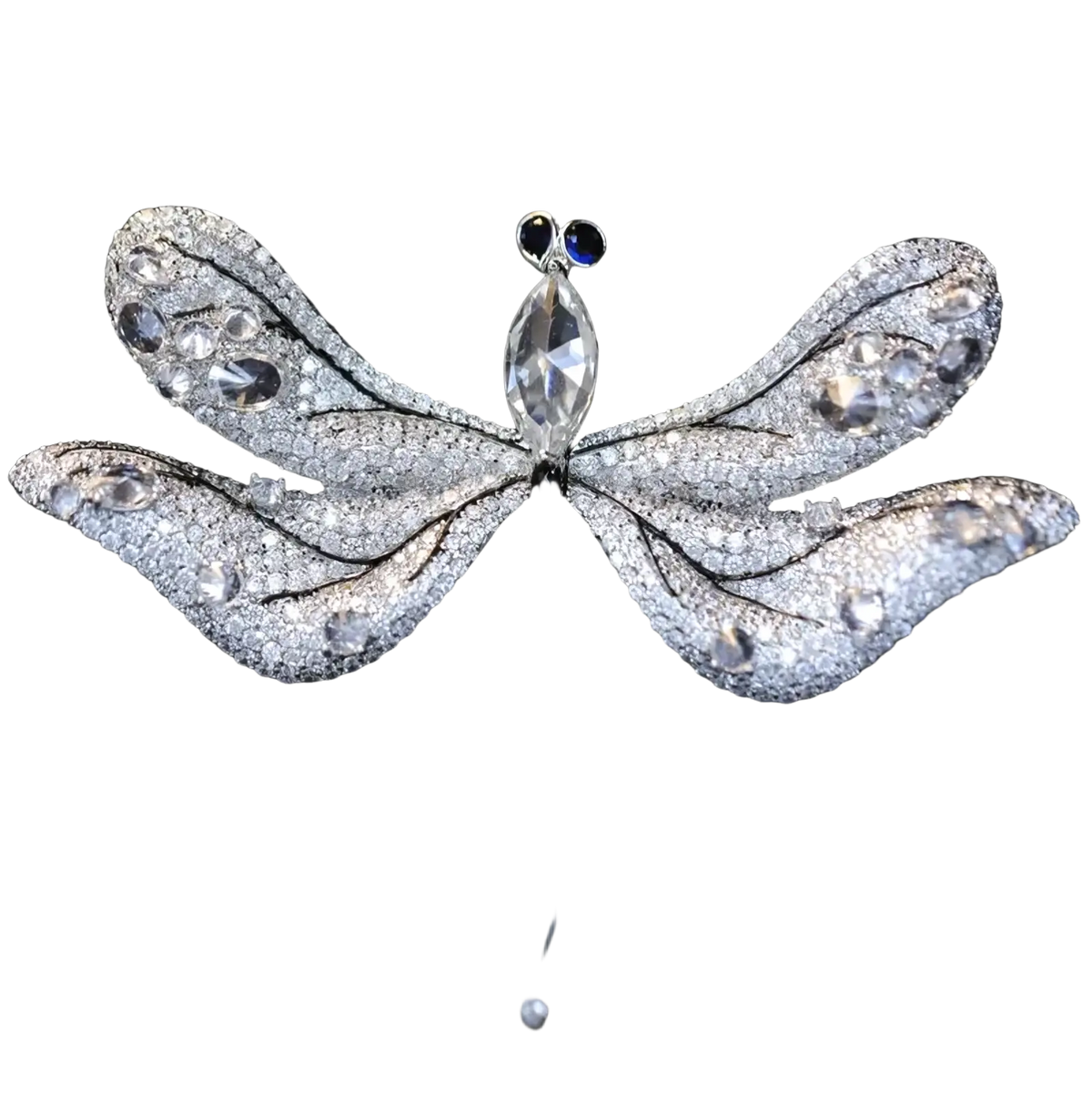 A silver dragonfly brooch with clear and blue crystals featuring intricate wing details in a luxury designer pin