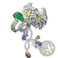 A zircon butterfly brooch featuring a sparkling multi-colored floral design with a green jadeite stone set in silver