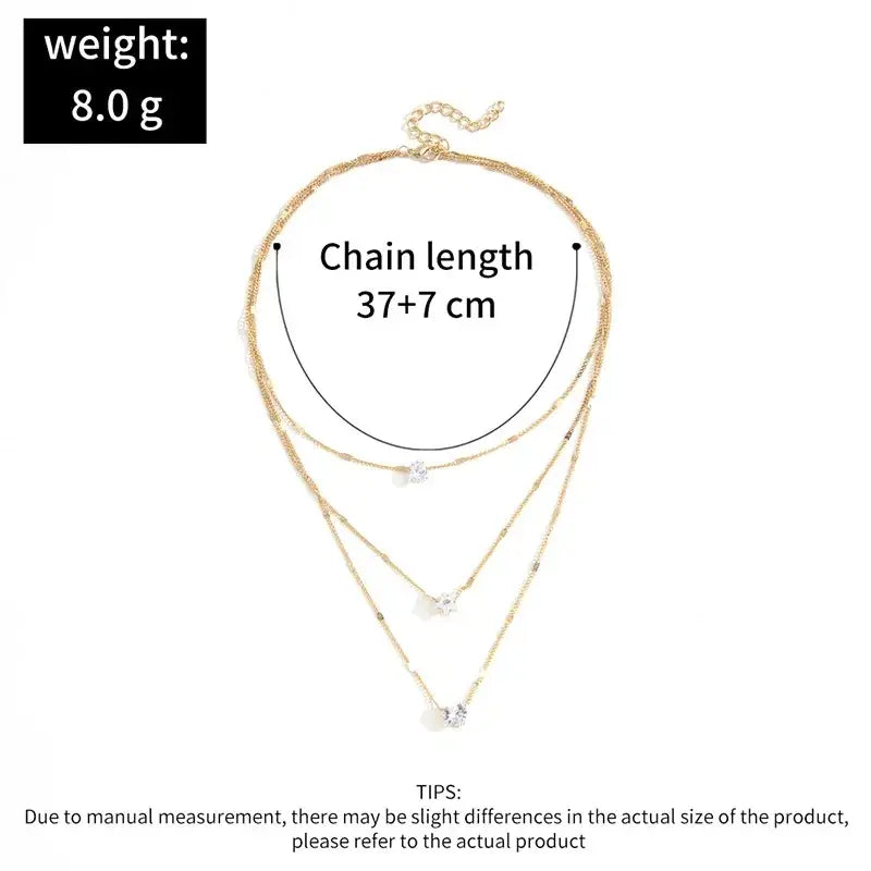 Gold-toned zircon layered pendant necklace for women featuring three delicate chains with crystal pendants and clasp closure