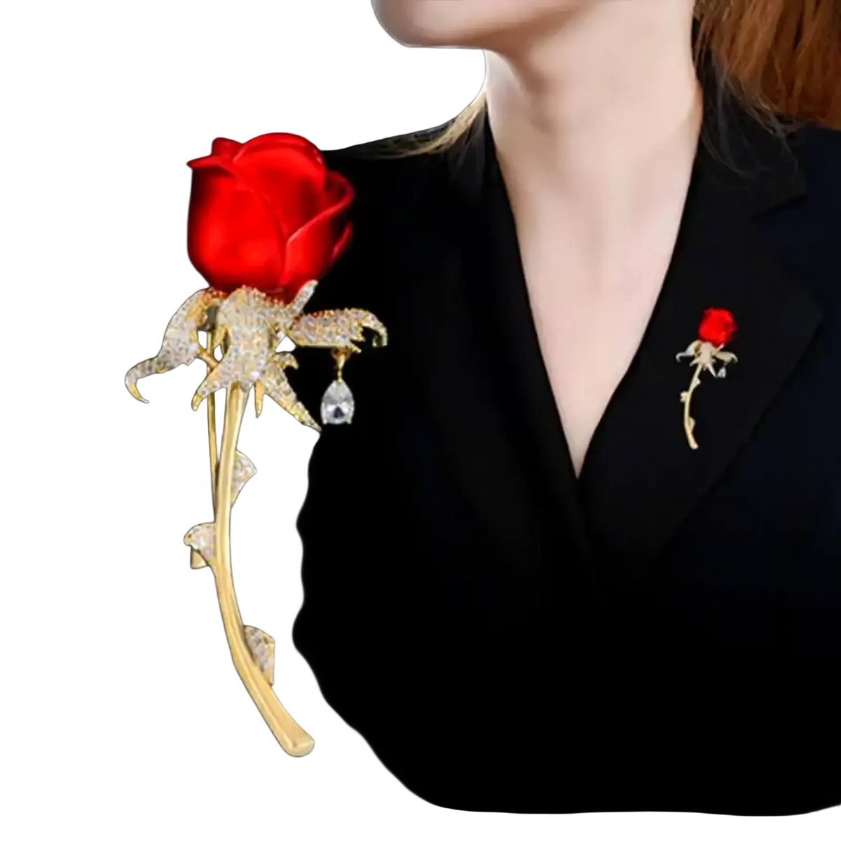 A sparkling gold zircon rose brooch with a red gemstone head and diamond-encrusted petals stem and leaves