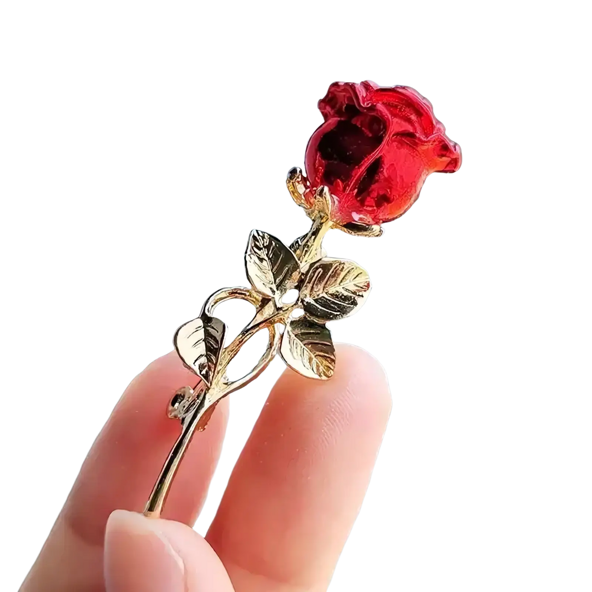 Zircon rose brooch with a translucent crystal red bloom and gold-toned stem and leaves pin accessory
