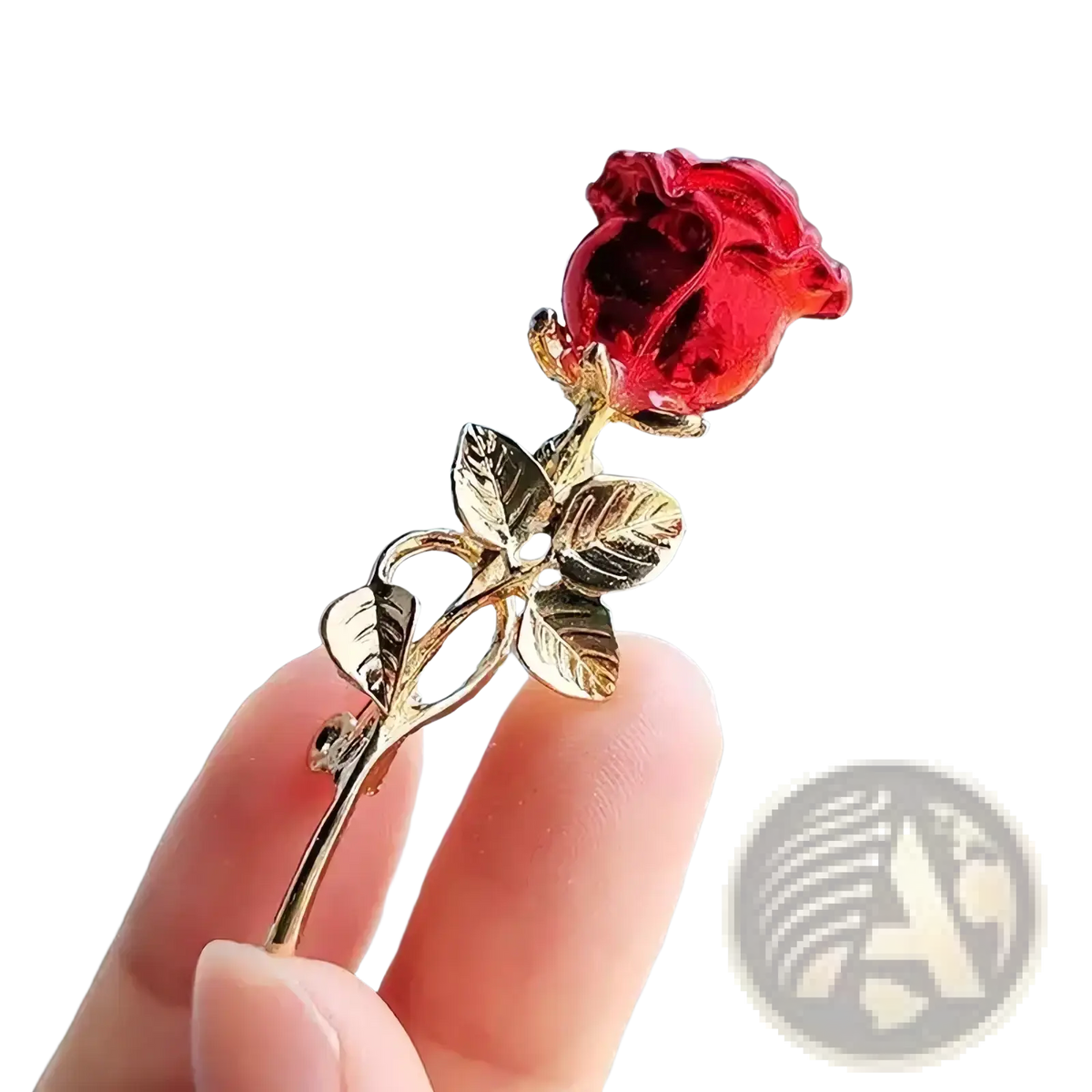 Zircon rose brooch with a translucent crystal red bloom and gold-toned stem and leaves pin accessory