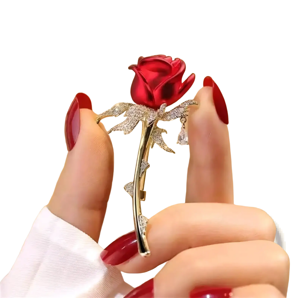 A sparkling red zircon rose brooch with gold-toned stem and clear crystal-adorned leaves