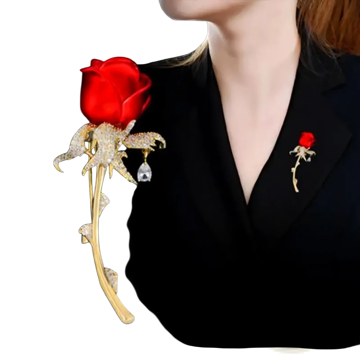 A sparkling gold zircon rose brooch with a red gemstone head and diamond-encrusted petals stem and leaves