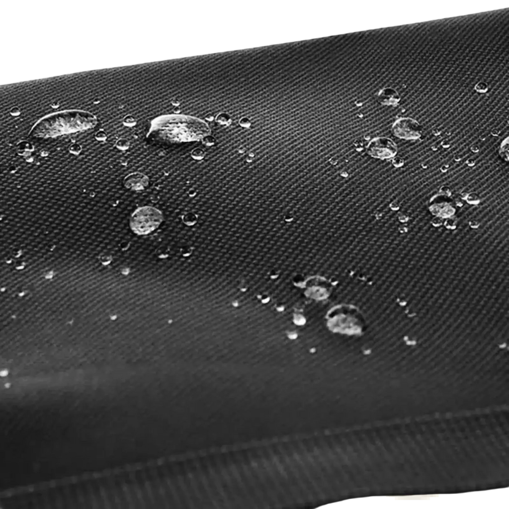 Black textured fabric with water droplets beading on the surface of the Ztz 50l waterproof dual bicycle pannier bag